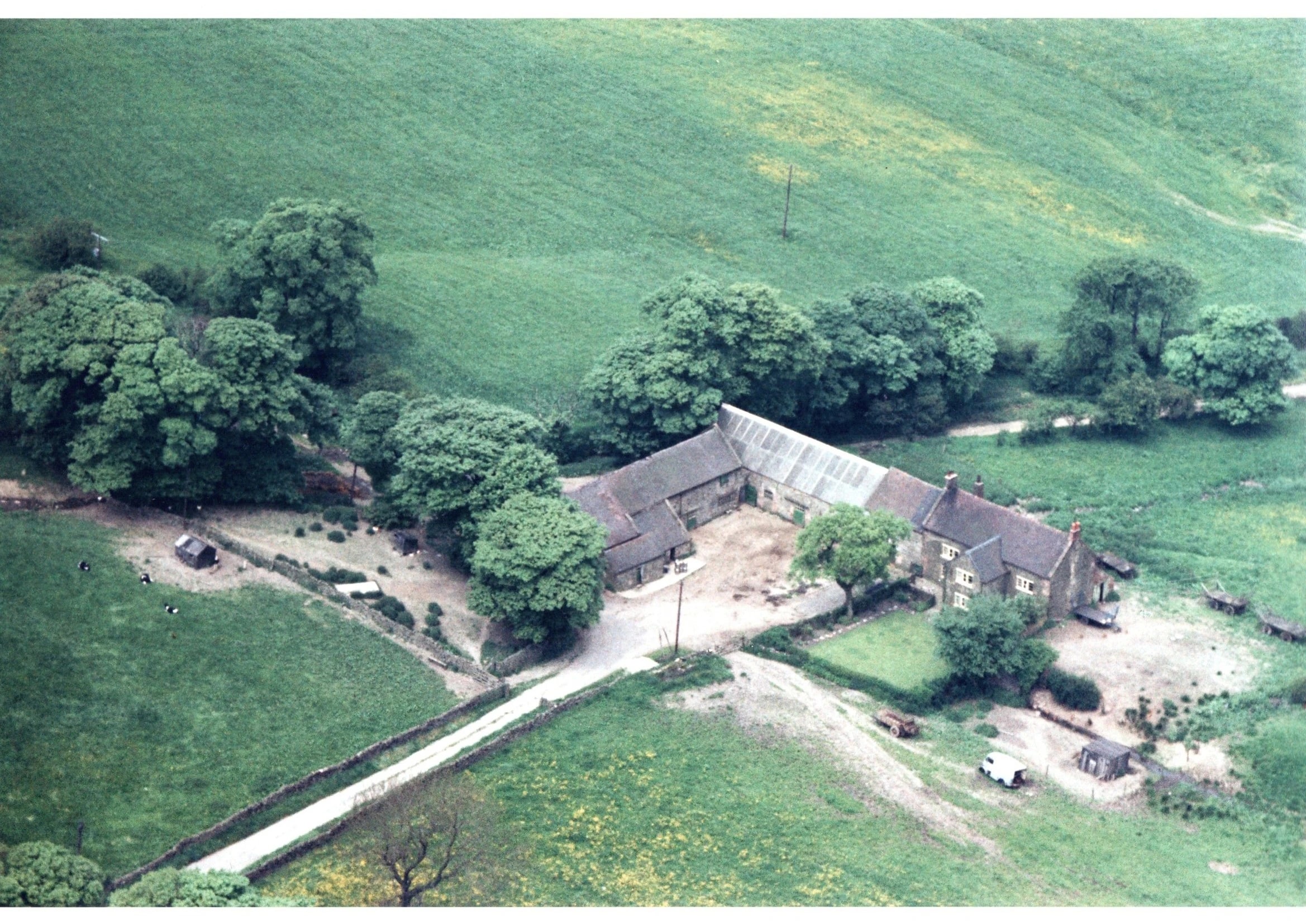 An aerial photograph of Lane Head Farm from 1967, showing the farmhouse and the old shippon that later became Morridge View