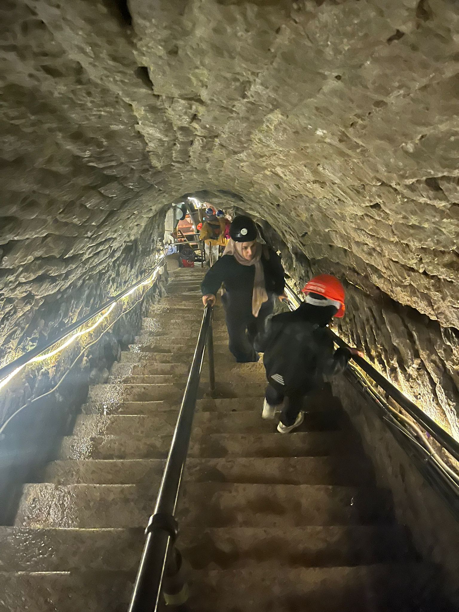 Looking down the steep stone stairway inside Speedwell Cavern