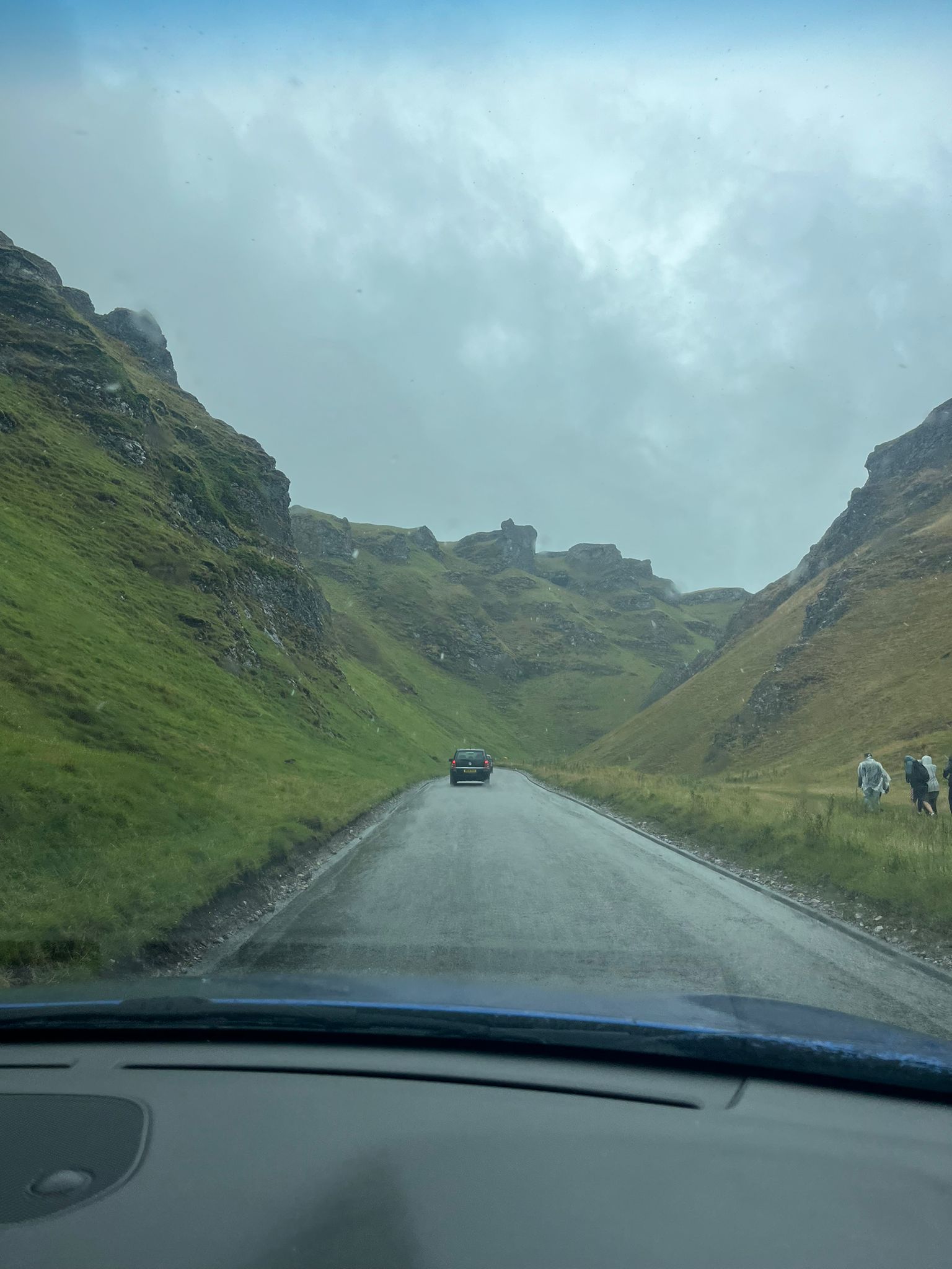 Driving through Winnats Pass towards Castleton on a grey Peak District day