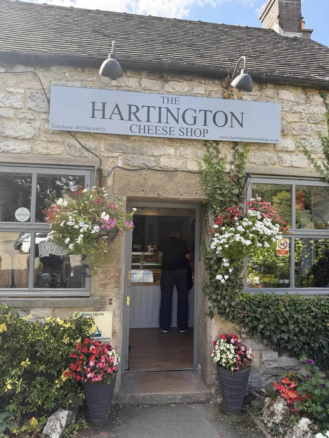 The flower-covered entrance to Hartington Cheese Shop
